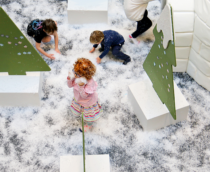 Playing with snow at the Snowstorm Maze